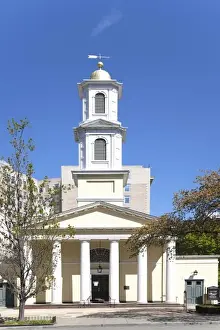 USA, Washington DC, A white church with romanesque columns sits with an office building on one side