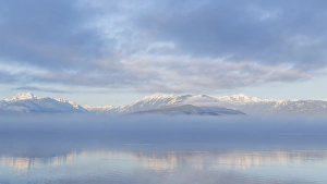Images Dated 7th January 2016: USA, Washington, Hood Canal. Winter sunrise mirrored in Hood Canal