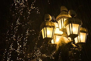 Leavenworth Prints: USA, Washington, Leavenworth. Snow-covered street lamps at night during Christmas holiday