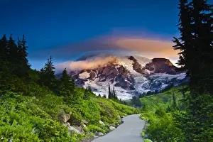 USA, Washington, Mt. Rainier. Morning sun blankets Mt. Rainier along the Skyline Trail