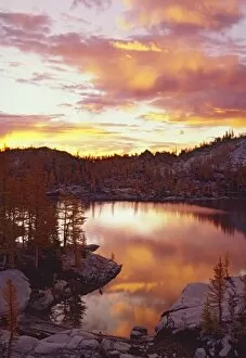 Images Dated 23rd October 2007: USA, Washington, North Cascade Mountains. Sunrise clouds reflect on Rune Lake, Sunrise