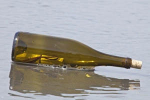 Images Dated 19th April 2009: USA, Washington, Olympic National Park. Close-up of message in a bottle washed up on shore