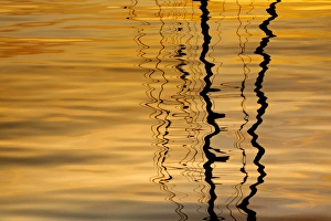 Images Dated 1st May 2012: USA, Washington, San Juan Islands. Sailboat mast reflection at sunset. Credit as