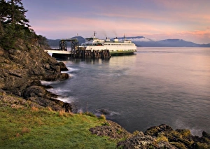 USA, Washington, San Juan Islands. A ferry at the Lopez Island dock at sunrise
