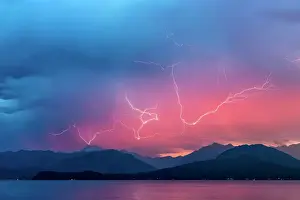 Thunderstorm Prints: USA, Washington, Seabeck. Lightning over Hood Canal and Olympic Mountains. Credit as