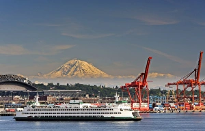 Images Dated 17th June 2011: USA, WAshington, Seattle. A ferry leaves Seattle for the outer islands with Mt