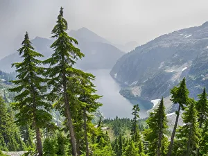 Images Dated 26th July 2019: USA, Washington State. Alpine Lakes Wilderness, Snow Lake, fire smoke filled sky