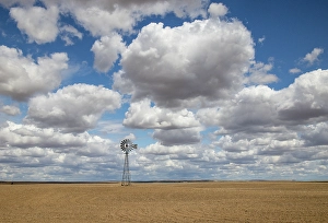 Wheat Prints: USA, Washington State. Highway 26 just west of Washtucna with clouds over wheat fields and windmill