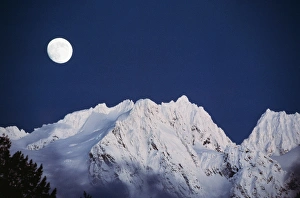 Snowcapped Prints: USA, Washington State, North Cascades, Full moon over snowcapped mountain