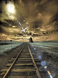 Railroad Prints: USA, Washington State, Palouse. Backcountry rail Road and Silo through wheat field with