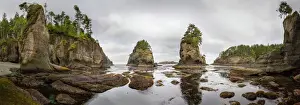 USA, Washington State, Panorama of sea kayakers paddling at Cape Flattery on the Olympic Coast