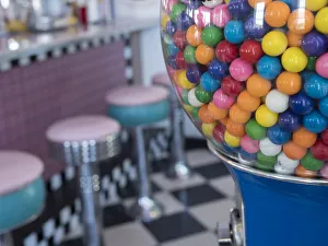Usa, Washington State, Port Townsend. Gumball machine and vintage stools at ice cream Usa, Washington State, Port Townsend. Gumball machine and vintage stools at ice cream