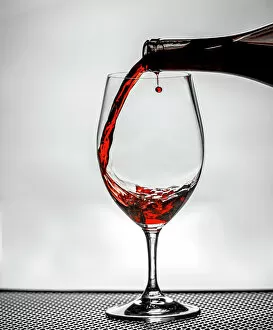 Editor's Picks: USA, Washington State, Spokane. Red wine poured into wine glass creates perfect round