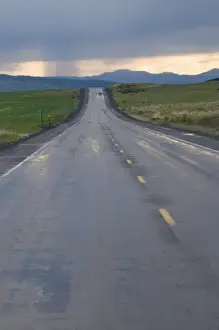USA, Washington State. Storm clouds and rain ahead over the road in Central Washington