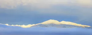 Images Dated 20th December 2022: USA, Washington State. Sunrise panoramic of snow-covered mountains in Olympic National Forest