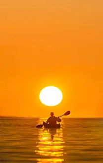 Images Dated 26th September 2015: USA, Washington State. Woman sea kayaker paddles on Puget Sound near Deception Pass