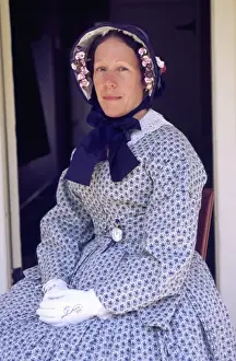 Perform Prints: USA, Washington, Tacoma. Portrait of woman re-enacter in 1850s period dress & bonnet