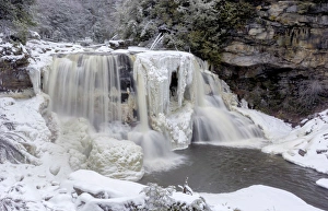 USA, West Virginia, Blackwater Falls State Park. Waterfall in winter landscape. Credit as