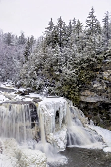 USA, West Virginia, Blackwater Falls State Park. Waterfall in winter landscape. Credit as