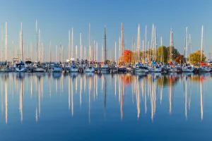 Wisconsin Prints: USA, Wisconsin. Panoramic view of Fall colors reflected on the still waters of the harbor