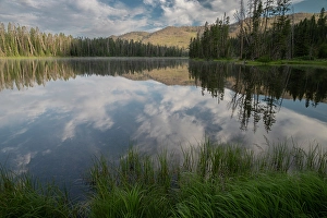 Images Dated 4th May 2024: USA, Wyoming. Clouds reflected in Sylvan Lake, Yellowstone National Park