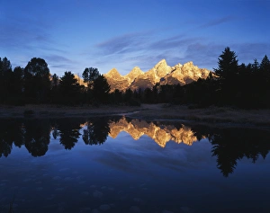 USA, Wyoming, Grand Teton National Park, Grand teton range reflecting in Beaver pond