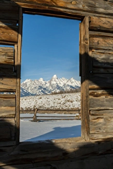 Images Dated 19th January 2014: USA, Wyoming, Grand Teton National Park. View of mountains through cabin doorway