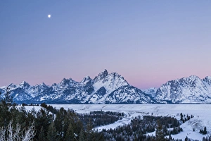 Images Dated 20th January 2014: USA, Wyoming, Grand Teton National Park. Moon over winter landscape