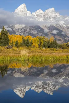 Images Dated 25th September 2016: USA, Wyoming, Grand Teton National Park. Grand Teton with fresh snow is reflected