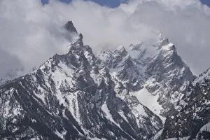 Images Dated 22nd June 2021: USA, Wyoming, Grand Teton National Park. Clouds over mountains during spring snowstorm