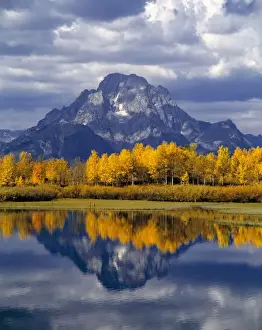 Tetons Prints: USA, Wyoming, Grand Teton NP. Against the blue-gray peaks of the Tetons, glowing