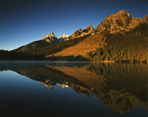 USA, Wyoming, Grande Teton National Park, Cathedral group mountain reflecting in