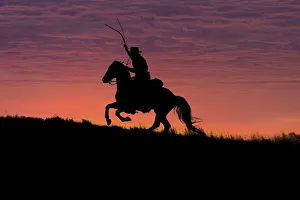 Images Dated 26th September 2011: USA, Wyoming, Shell, The Hideout Ranch, Silhouette of Cowboy and Horse at Sunset (MR / PR)