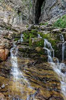 Teton Prints: USA, Wyoming. Waterfall coming out of Wind Cave, Teton Mountains