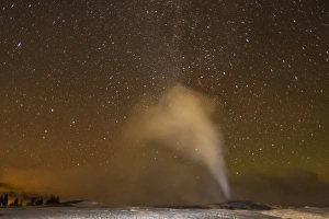 USA, Wyoming, Yellowstone National Park. Old Faithful Geyser at night. Credit as
