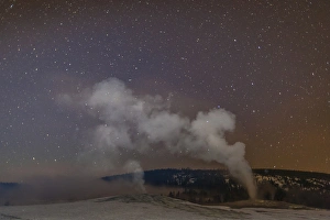 Images Dated 20th January 2014: USA, Wyoming, Yellowstone National Park. Old Faithful Geyser at night. Credit as