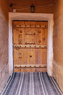 Adobe Prints: Ushaiger Heritage Village, Riyadh, Saudi Arabia. Decorative old wooden door