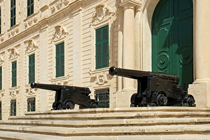 Malta Prints: Valetta, Malta. Government building with ancient canons lined up in front of the entry