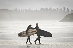 Couple Prints: Vancouver Island, Pacific Rim National Park. Surfers on the beach