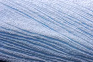 various textures on an iceberg floating off the western Antarctic peninsula, Antarctica
