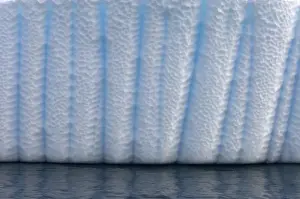 various textures on an iceberg floating off the western Antarctic peninsula, Antarctica