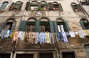 Suburb Prints: Venice, Veneto, Italy - Laundry is hanging on an outside clothesline to dry in an