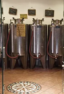 Industrial Prints: Venice, Veneto, Italy - A row of shiny metal vats containing wine for sale in bulk