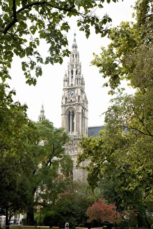 Low Angle Prints: Vienna, Austria - Low angle view of an ornate, old world church. Trees are framing
