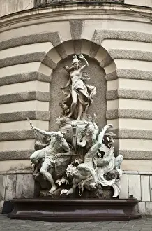 Low Angle Prints: Vienna, Austria - Low angle view of a statue of three beings of a mythological nature