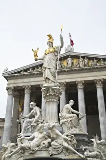 Vienna, Austria - A romanesque statue stands on a dry water feature in front of a
