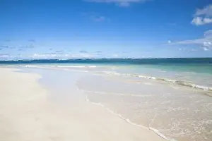 Vieques, Puerto Rico - Gentle waves are rolling up onto the white sands of a tropical beach