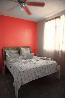 Communication Prints: Vieques, Puerto Rico - A laptop is sitting in the middle of an unmade hotel bed