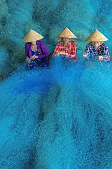 Prints of Vietnam. Women repairing fishing nets Asia Prints: Vietnam. Women repairing fishing nets