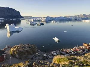 View of fjord full of icebergs towards Nuussuaq peninsula during midnight sun